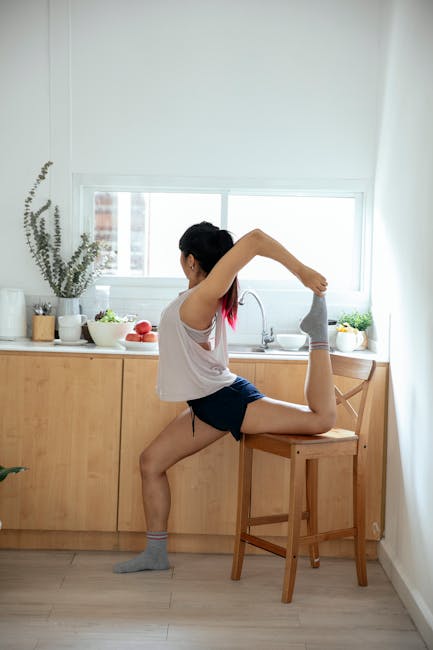 Beginner carefully trying a yoga pose at home.